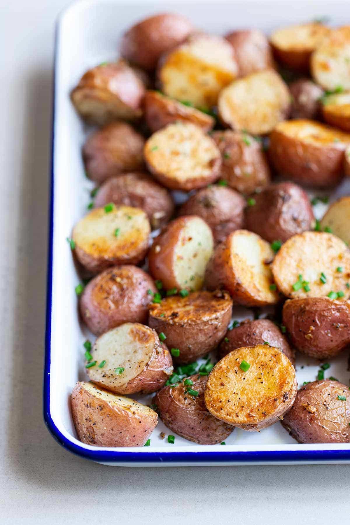 Oven-Roasted Potatoes in a white sheet pan
