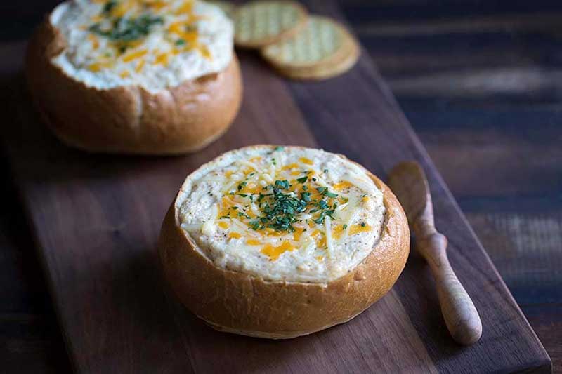 A photo of easy crab dip recipe in a bread bowl.