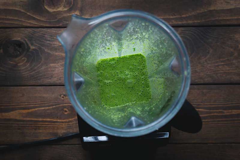 Overhead shot of cilantro dressing in a blender