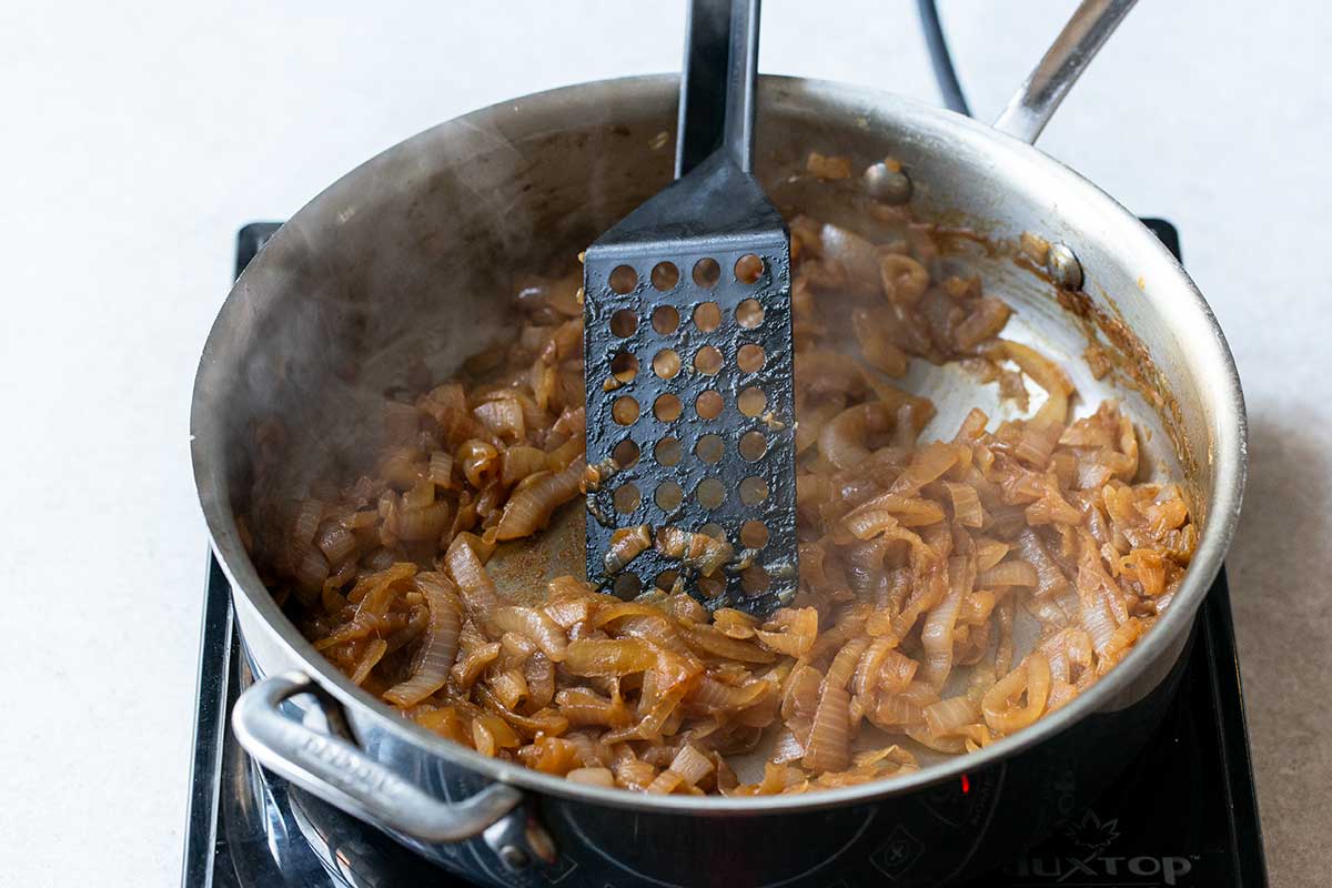 Caramelized onions in pan with spatula