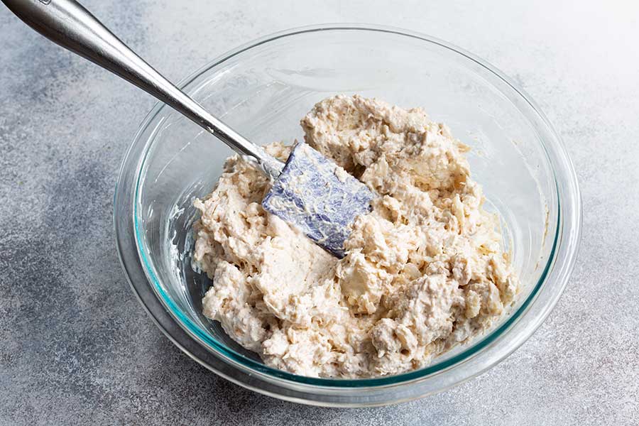 Hot crab dip recipe ingredients mixed together in a bowl