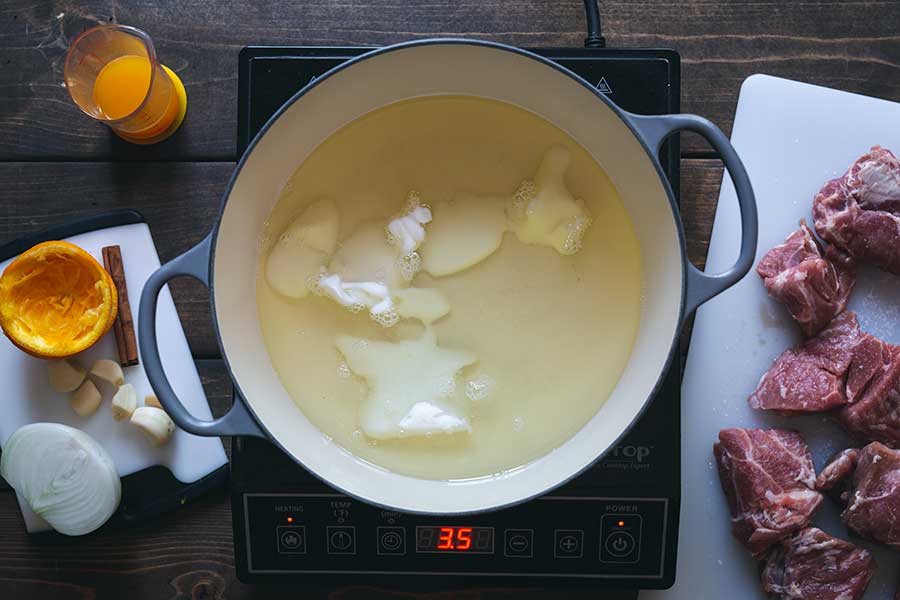 Lard melting in a Dutch oven