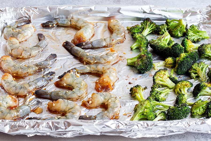 shrimp and broccoli on a sheet pan