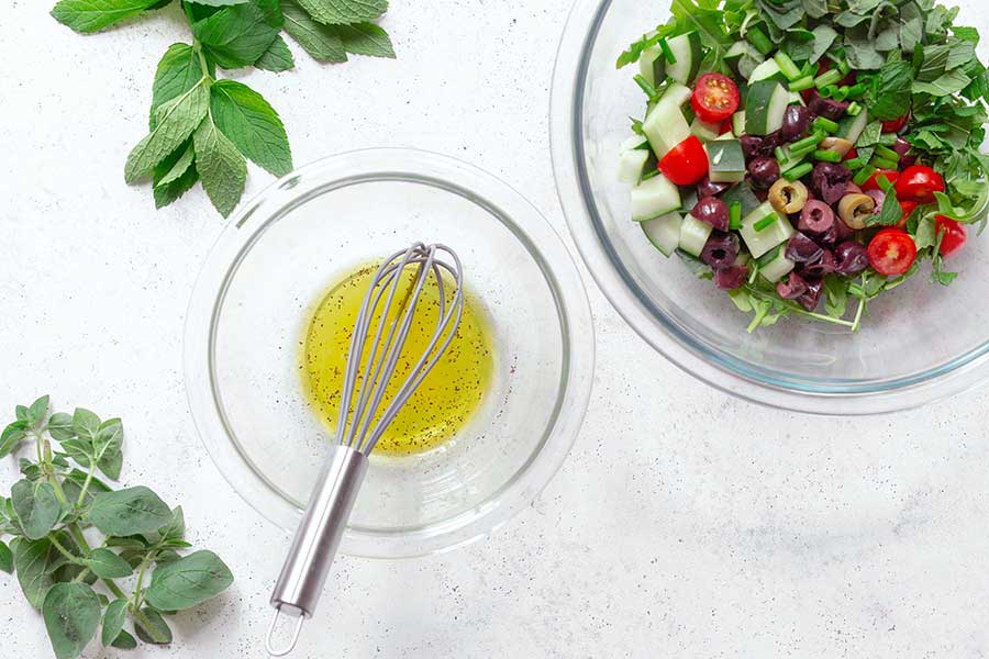 Combining Greek salad dressing ingredients