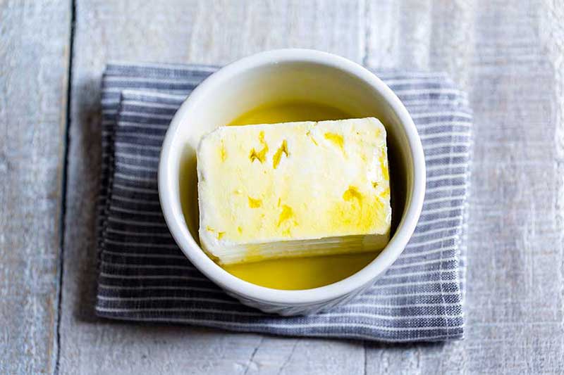 extra virgin olive oil drizzled over feta cheese
