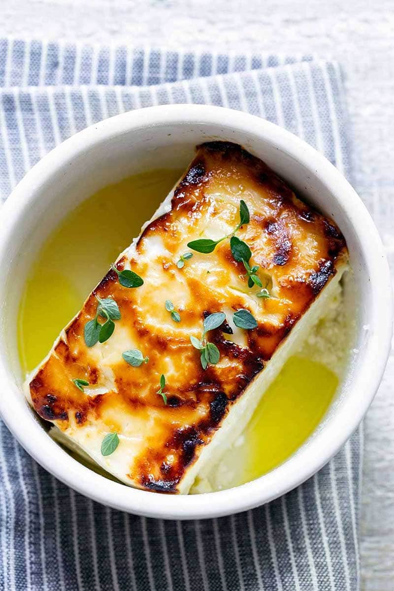 baked feta in a ramekin with honey and thyme