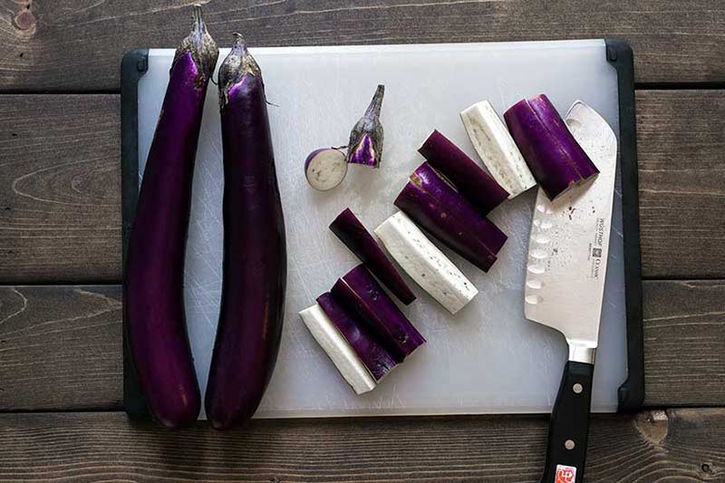 Eggplant being sliced into strips