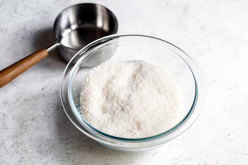 Shredded unsweetened coconut flakes in a bowl