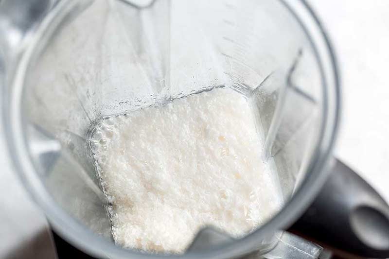 Coconut flakes and hot water pureed in a blender