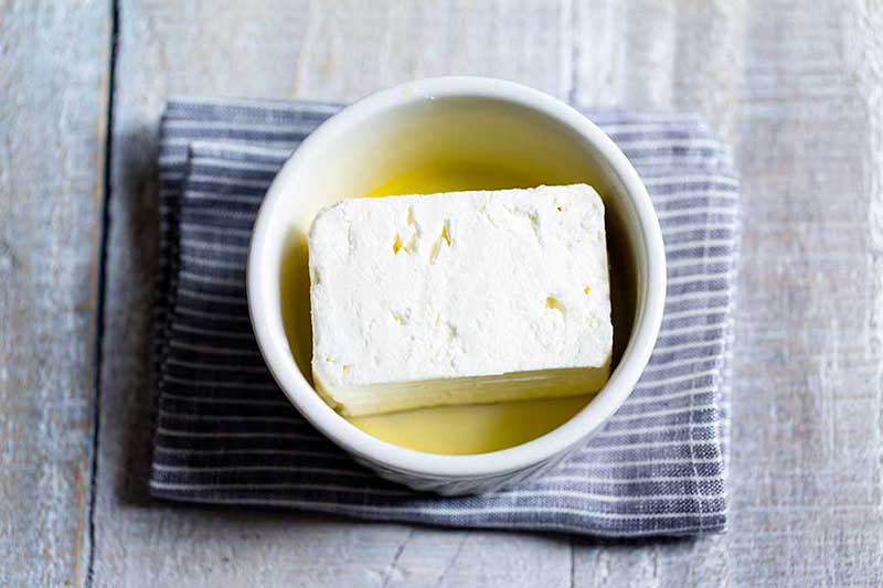 block of good quality feta in a ramekin