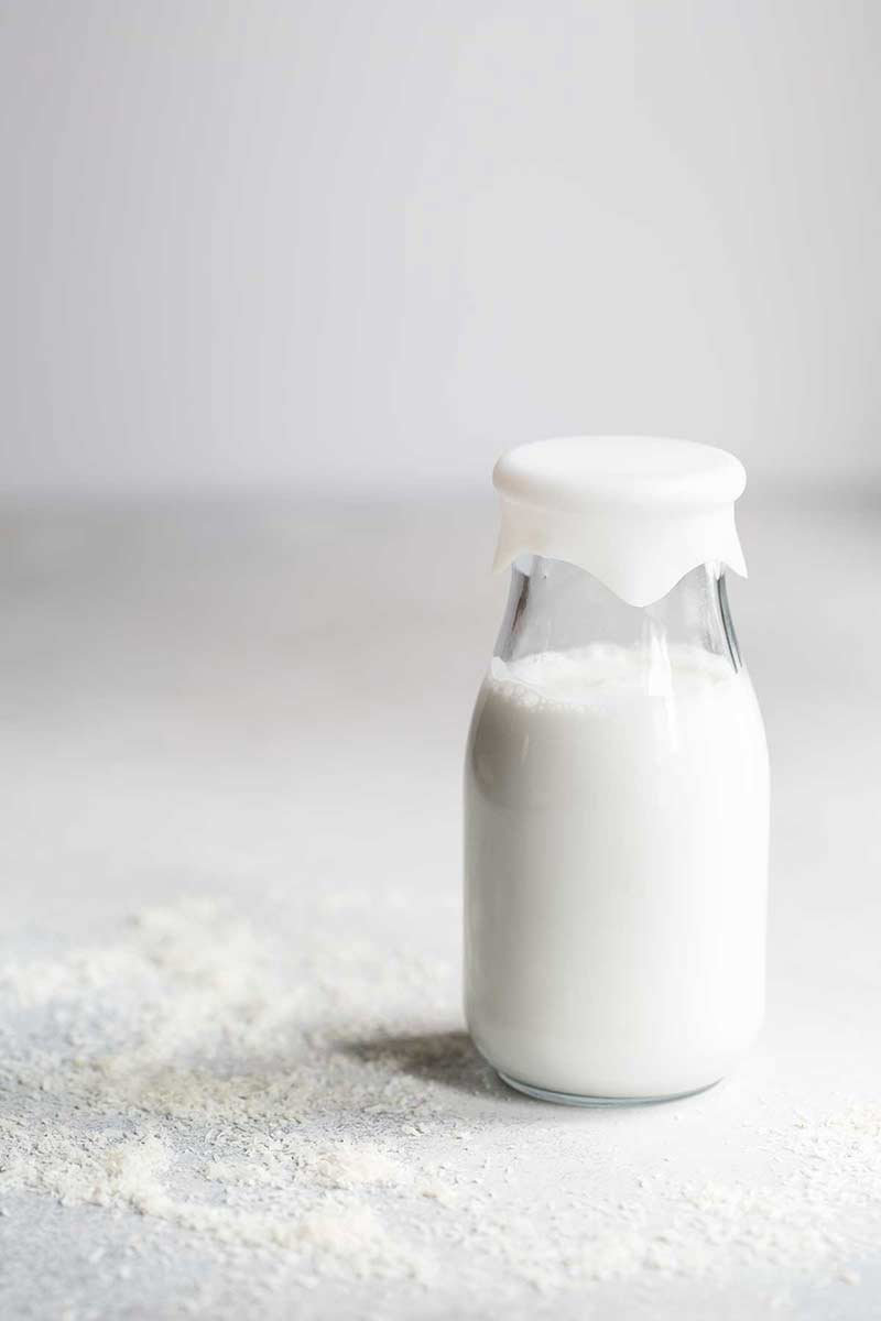 homemade coconut milk recipe in glass milk jar