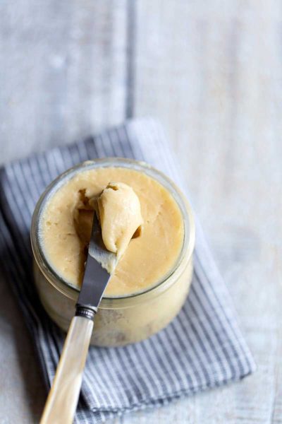 whipped maple butter in a mason jar with a butter knife