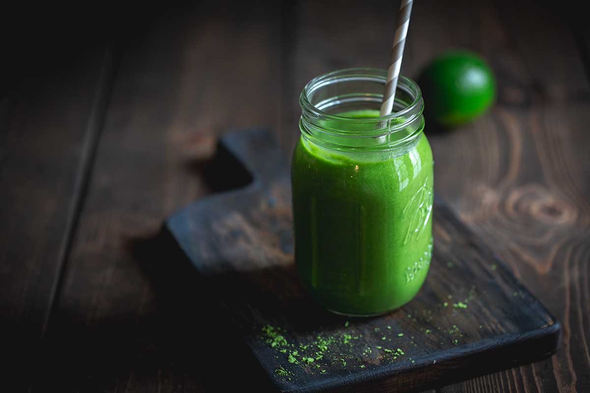 Pineapple matcha smoothie on cutting board