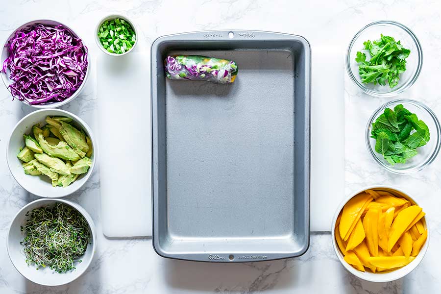 One summer roll in a lightly greased baking pan