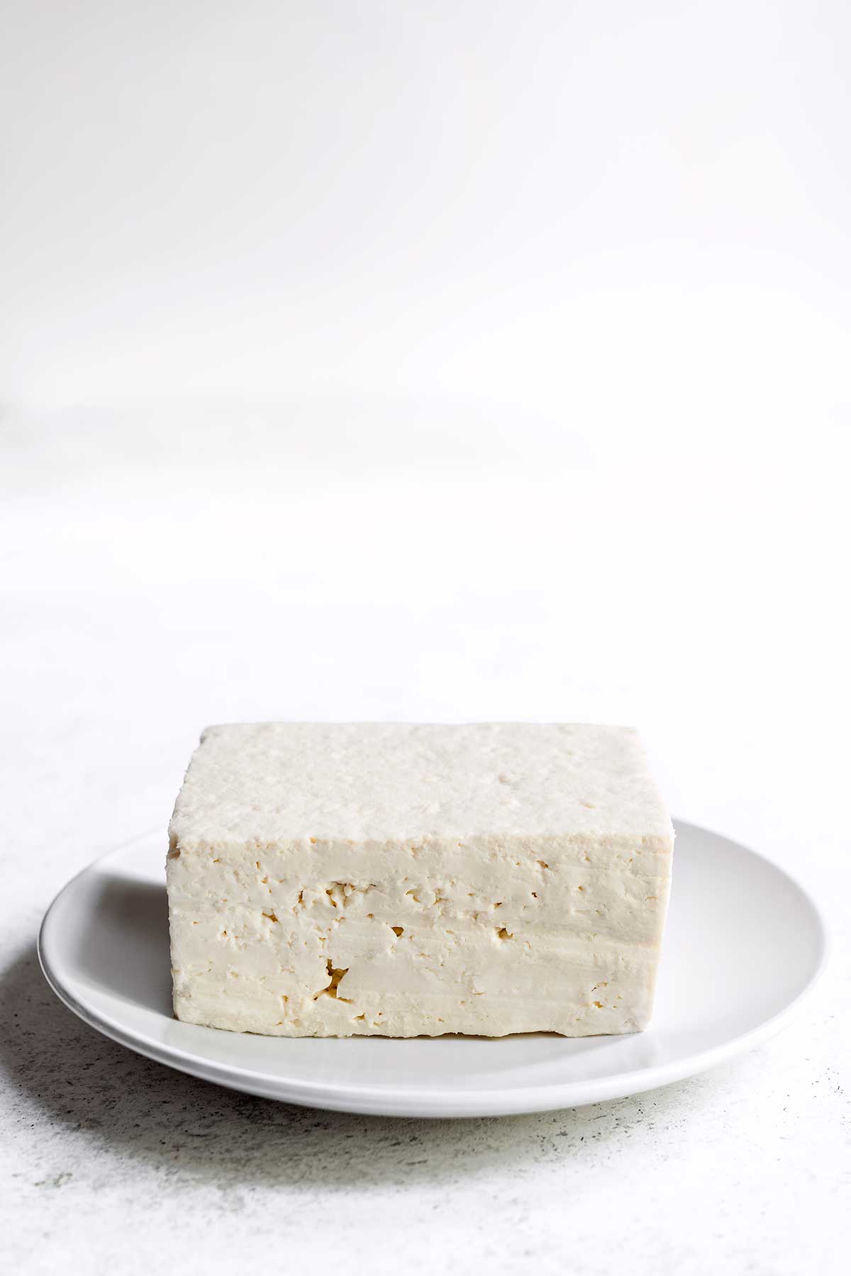 Firm tofu on a white plate