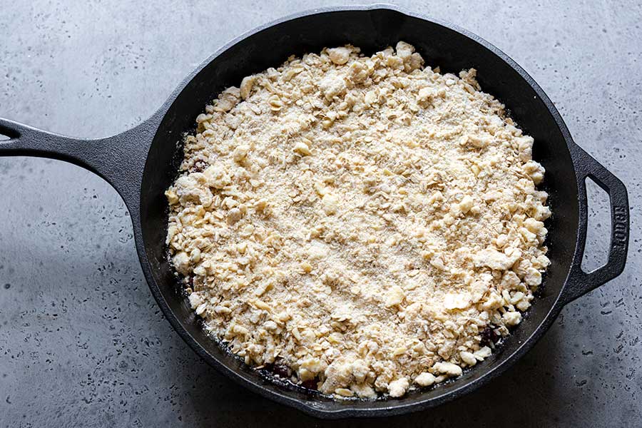 Cherry crisp topping spread evenly over the filling