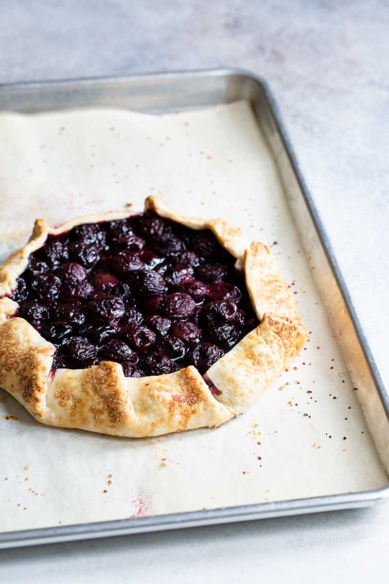 Cherry galette recipe on sheet pan just out of the oven