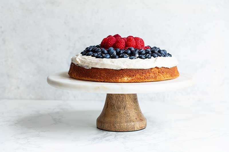 An additional layer of raspberries and blueberries added over the first to create height.