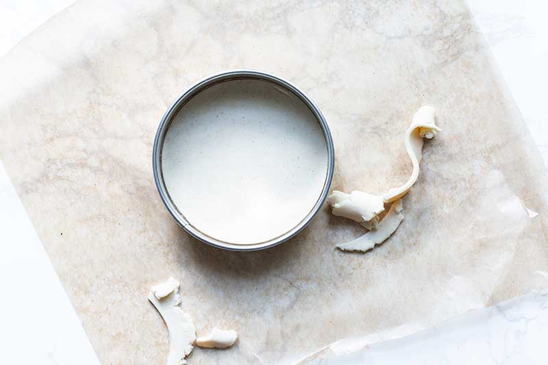 removing the excess dough from around the the biscuit cutter