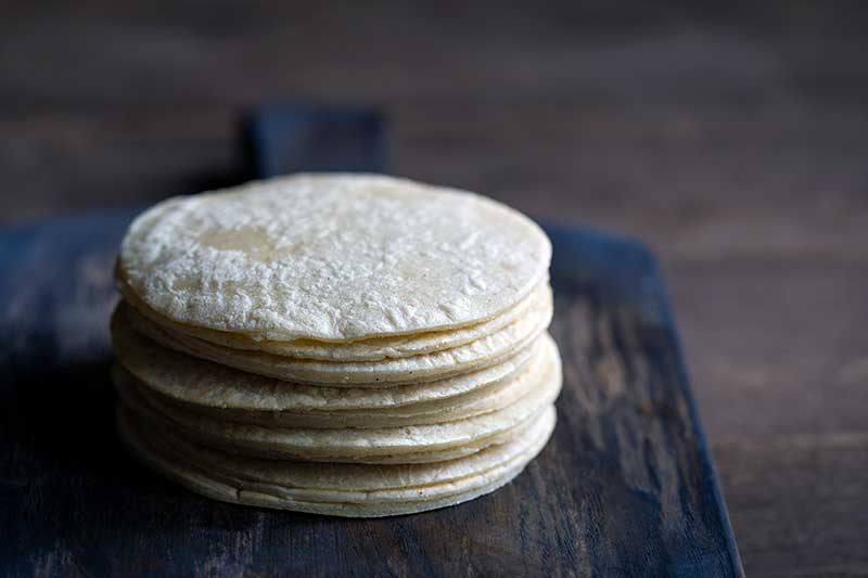 stack of fresh soft tortillas made without a press