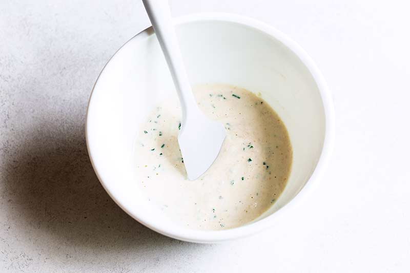 prepared horseradish sauce in a bowl with a spatula 