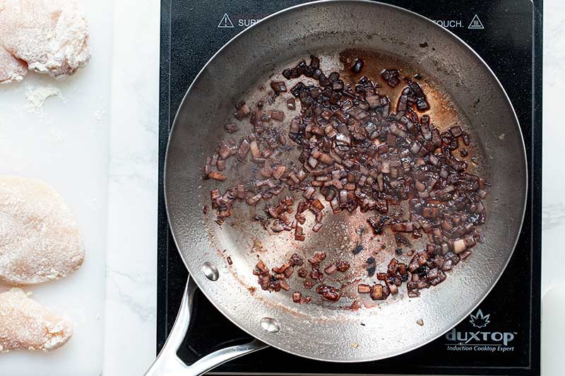 Deglazing the skillet with red wine