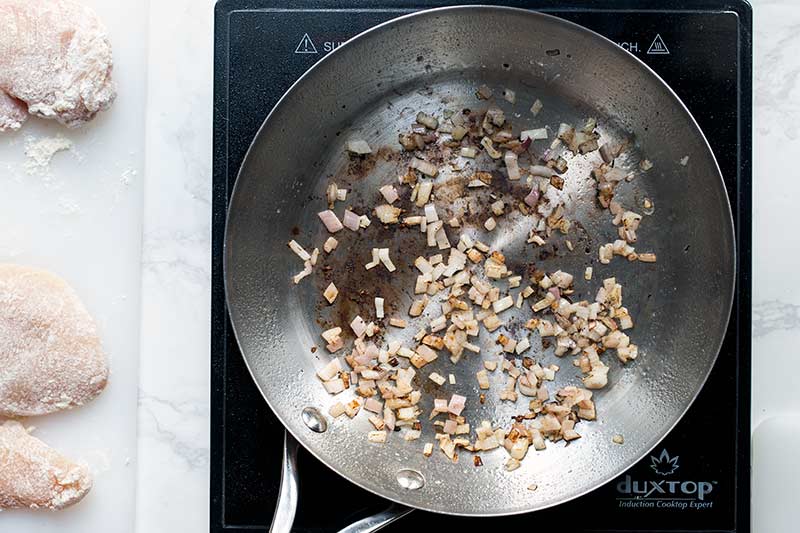 Adding shallots to the still hot, just-used skillet