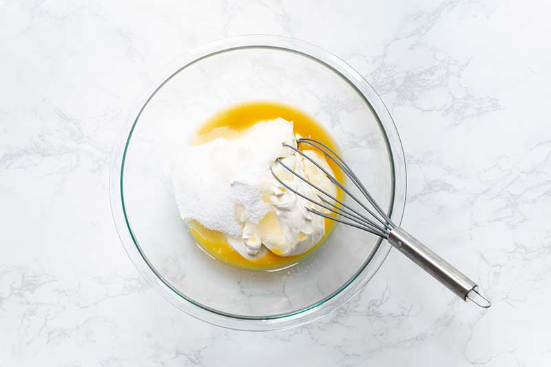 Whisking together ingredients for blintz soufflé recipe