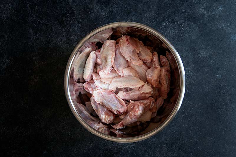 Chicken wings in the bottom of an electric pressure cooker