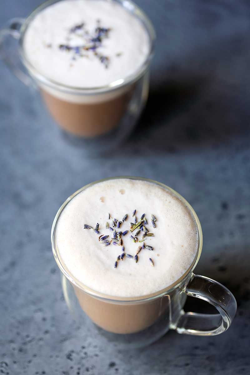 overhead photo: London Fog Latte in 2 clear mugs, topped with dried lavender