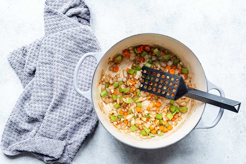 Mirepoix that has been cooked in the same dutch oven used to sear meat