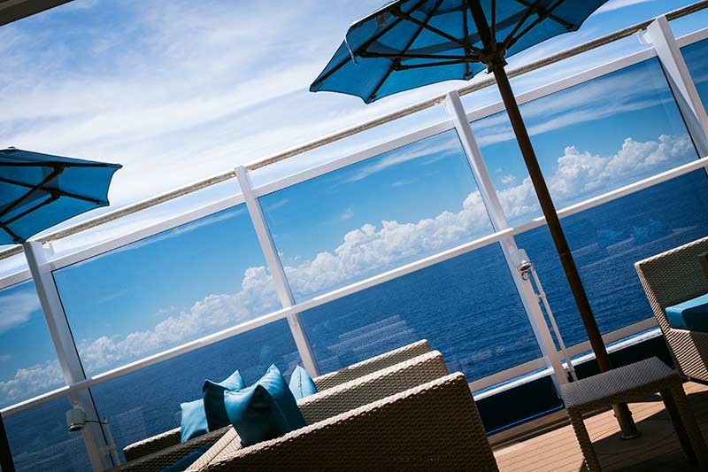 The quiet deck on Carnival Horizon, with umbrellas and lounge chairs