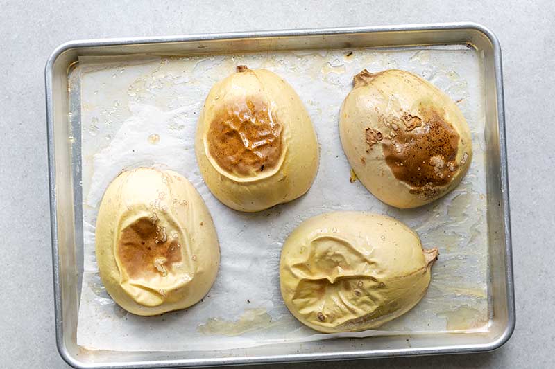 Roasted spaghetti squash on a sheet pan, face down