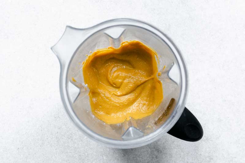 Pumpkin sauce being pureed in a blender