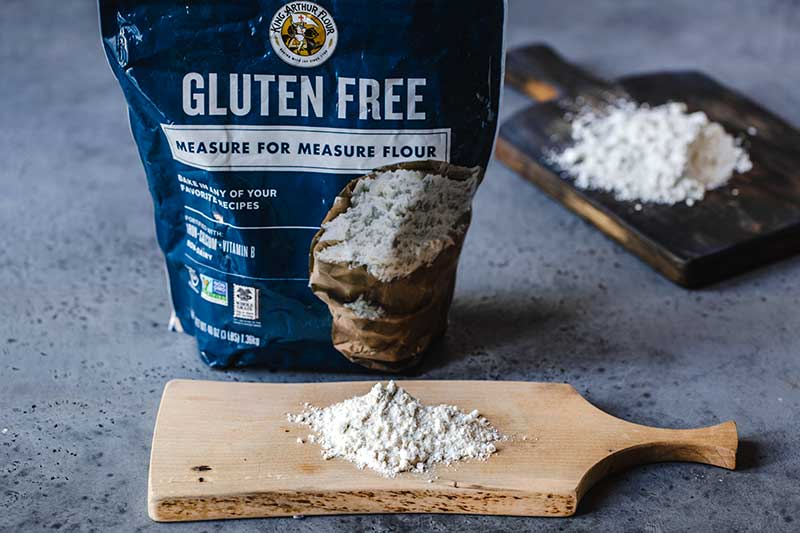 gluten-free flour in a bag and on cutting board