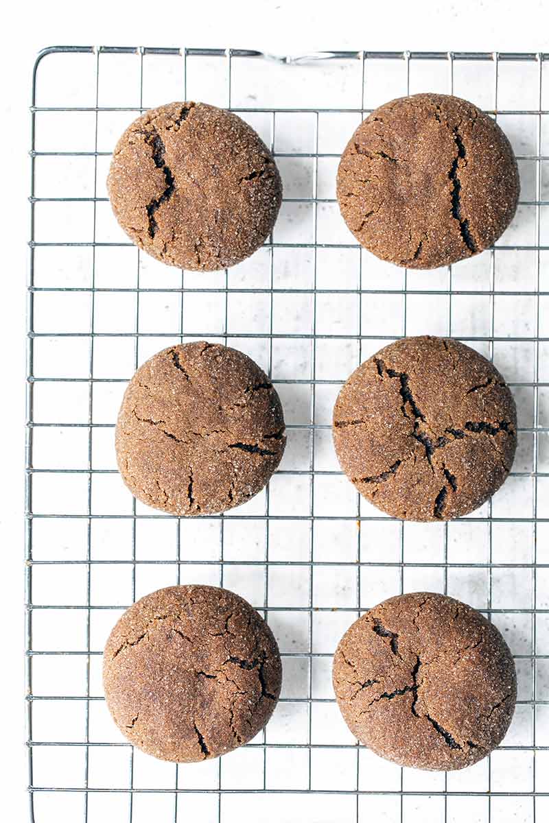 Homemade soft ginger molasses cookies on a cooling rack