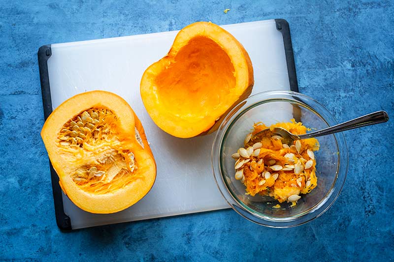 Pumpkin seeds scooped into a bowl