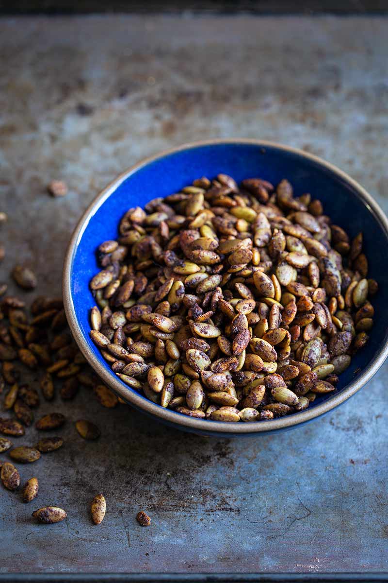 Sweet and Spicy Maple Roasted Pumpkin Seeds in a bowl