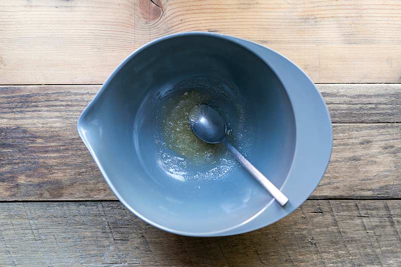 gelatin dissolving with warm water in a large bowl