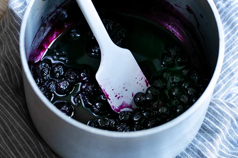 closeup of cooked blueberry compote in saucepan