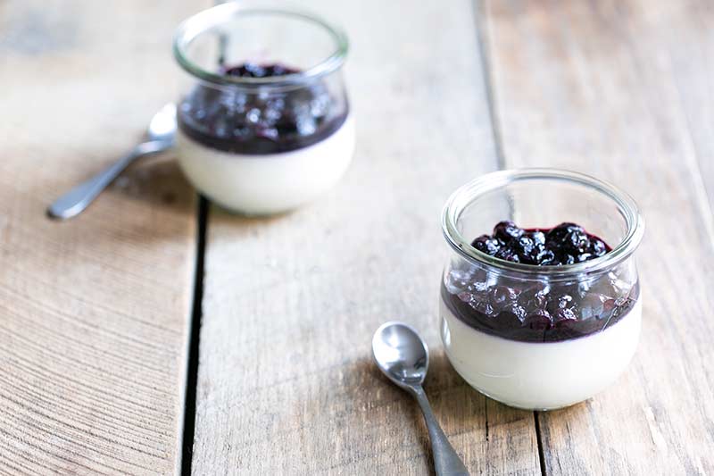 - Buttermilk panna cotta recipe topped with blueberry compote, served in two mason jars