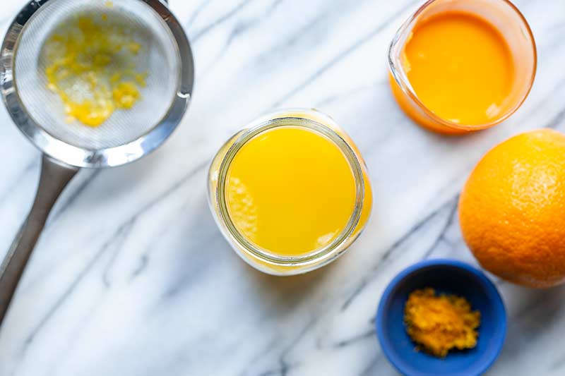 Orange juice pressed through a fine mesh strainer to remove pulp