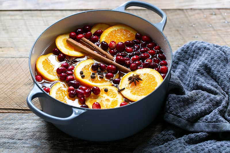 Simmering potpourri recipe ingredients in a Dutch oven
