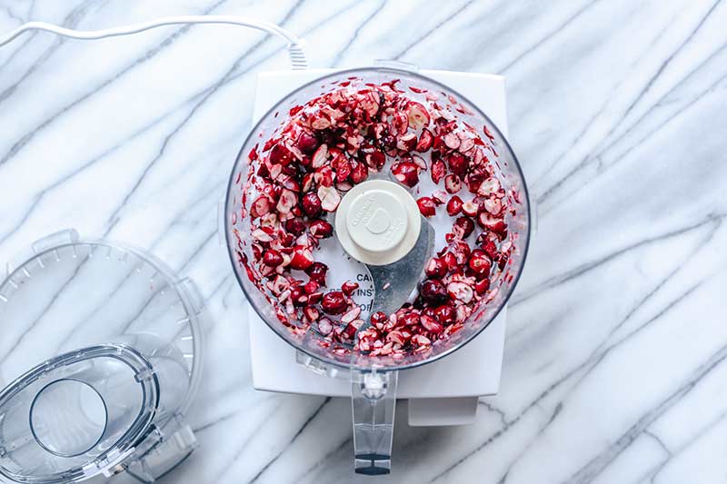 Fresh cranberries chopped in a food processor.