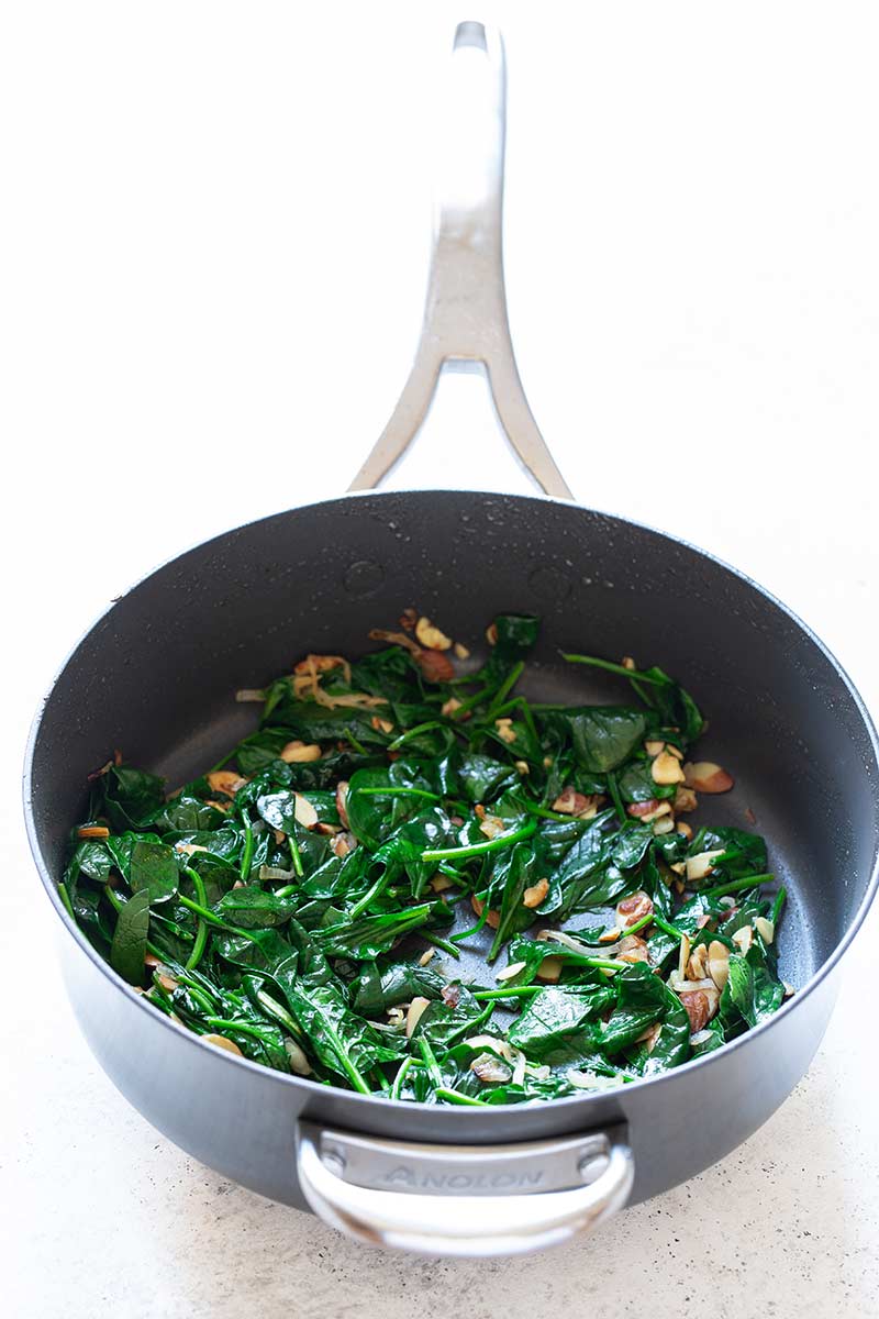 the spinach once it has cooked down in the same skillet