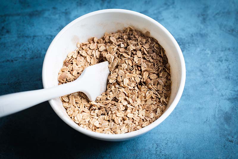 Dry ingredients in a bowl with a spatula