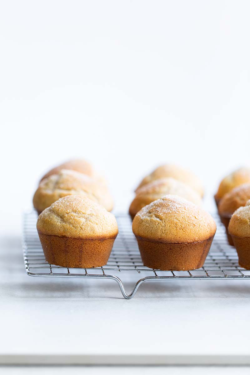 Cardamom cinnamon sugar muffins on a cooling rack
