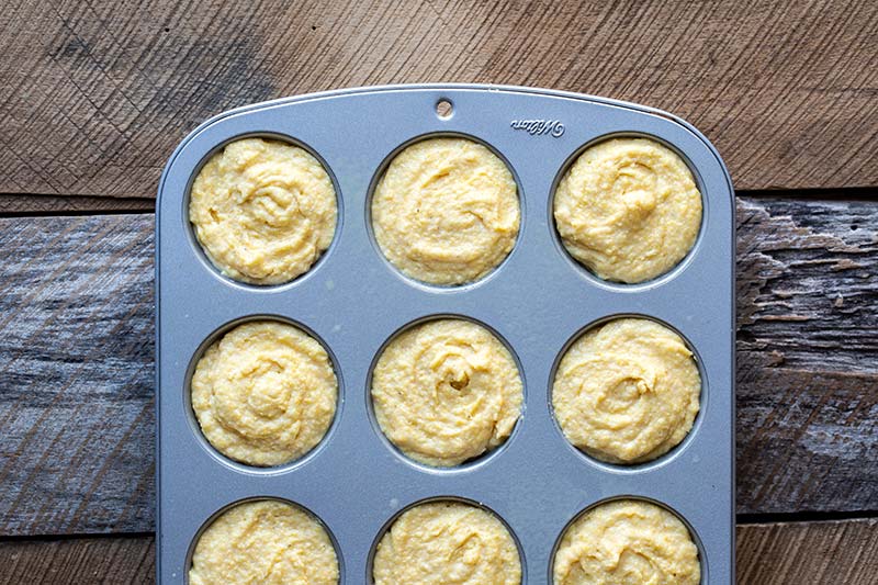 Unbaked muffin batter in a pan