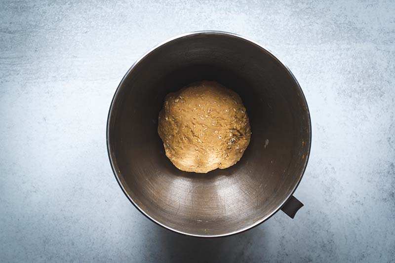 Bread dough in the bowl of a stand mixer