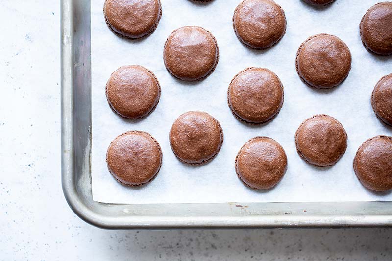 chocolate macarons out of the oven